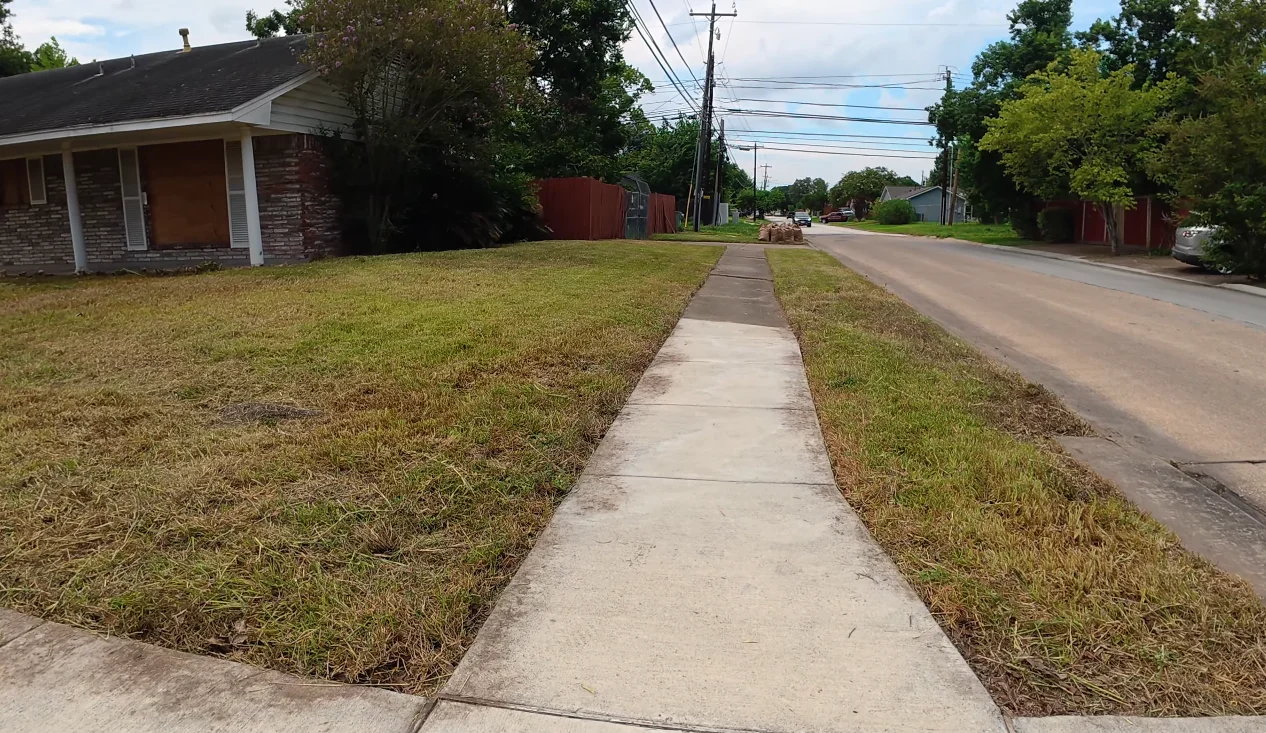 aiken lawn care after — clean trimmed shrubs and manicured lawn showing home curb appeal