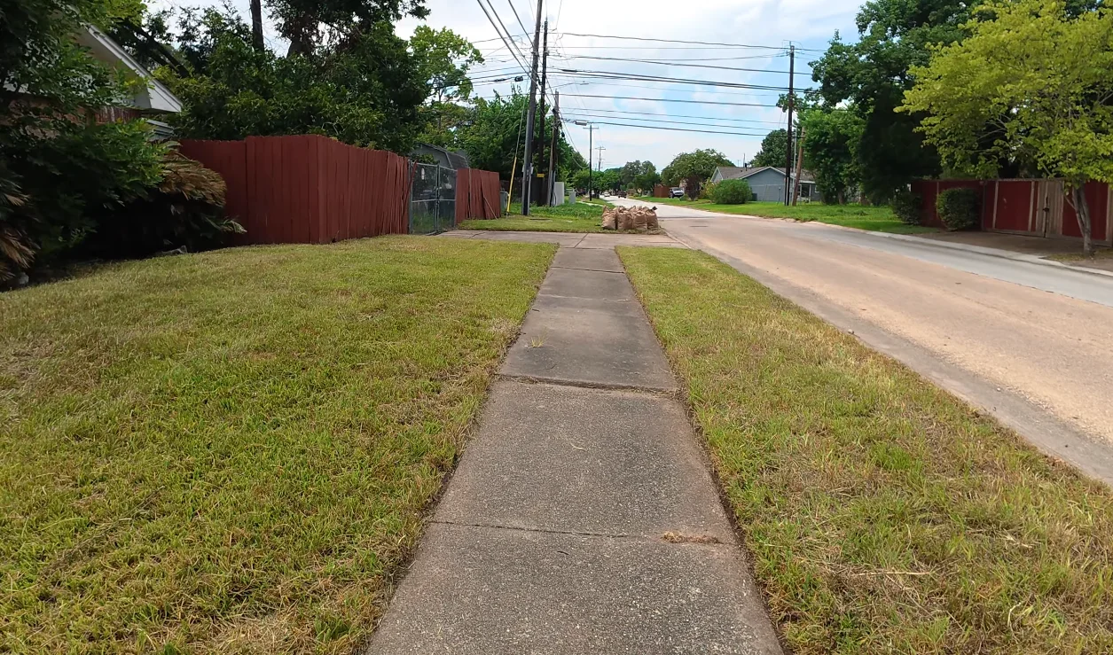 lawn service aiken sc after — professionally mowed lawn with clean edges and neat beds